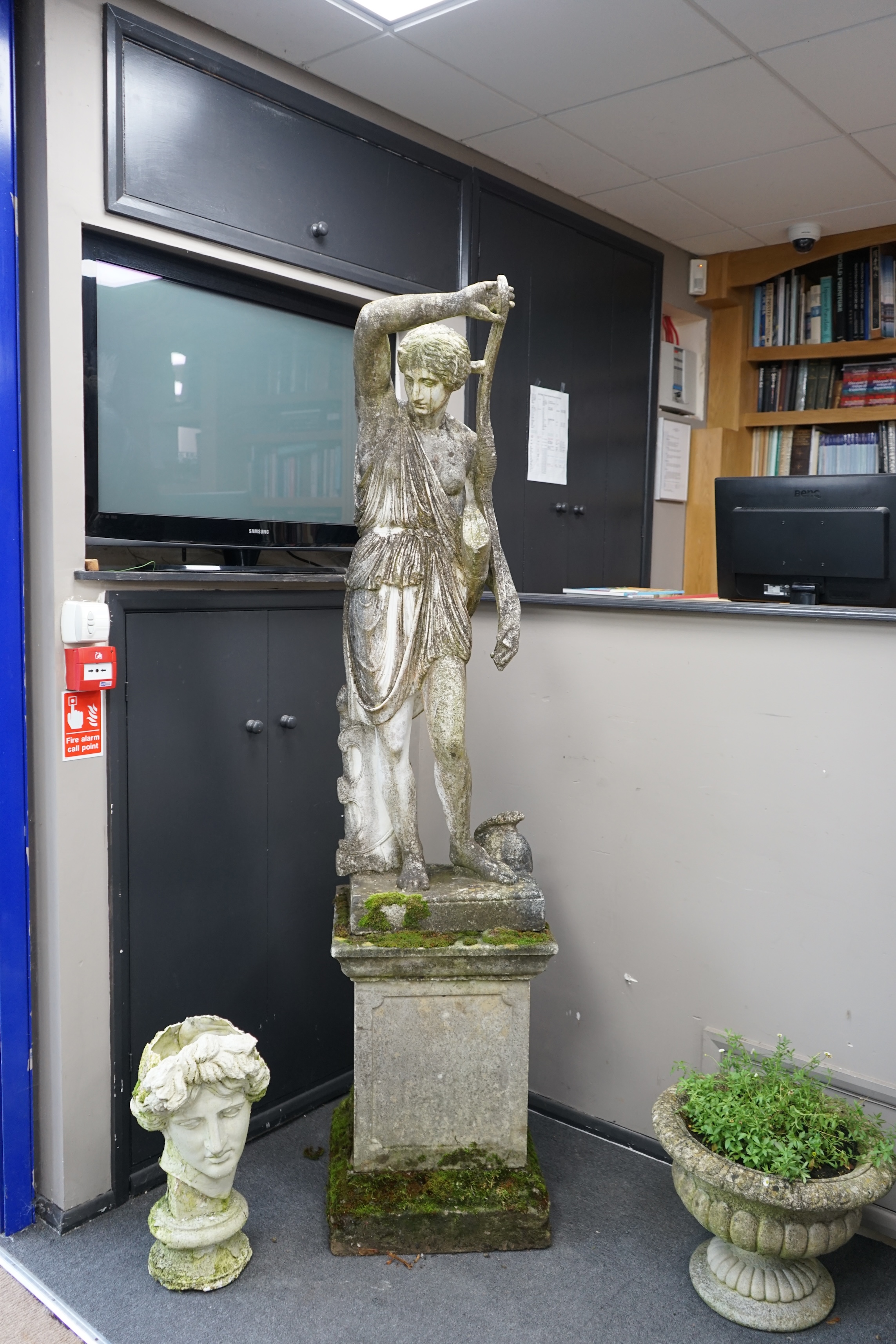 An Italian composition marble statue of Diana the Huntress, on a square reconstituted stone plinth